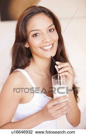 Stock Image - Woman drinking milk. Fotosearch