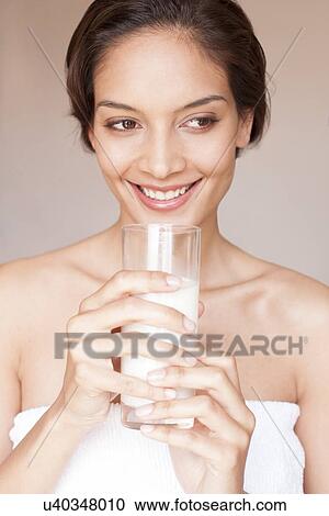 Stock Image - Woman drinking milk. Fotosearch