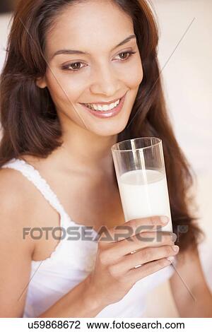Stock Image - Woman drinking milk. Fotosearch