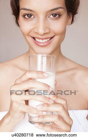 Stock Photo - Woman drinking milk. Fotosearch