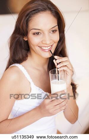 Stock Photo - Woman drinking milk. Fotosearch