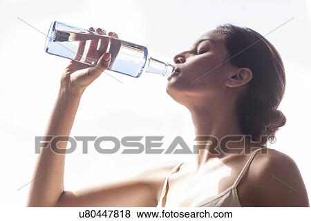 Woman drinking water View Large Photo Image Stock Photo - Woman drinking water. Fotosearch