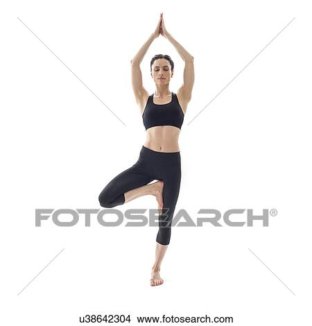 Picture - Woman practicing yoga. Fotosearch