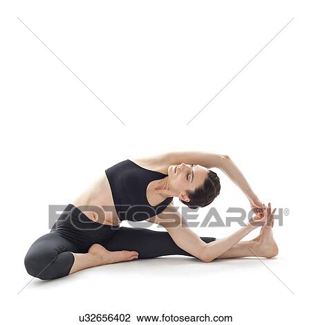 Stock Image - Woman practicing yoga. Fotosearch