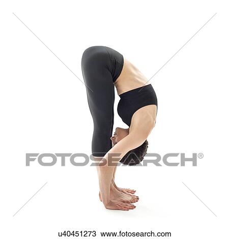 Stock Image - Woman practicing yoga. Fotosearch
