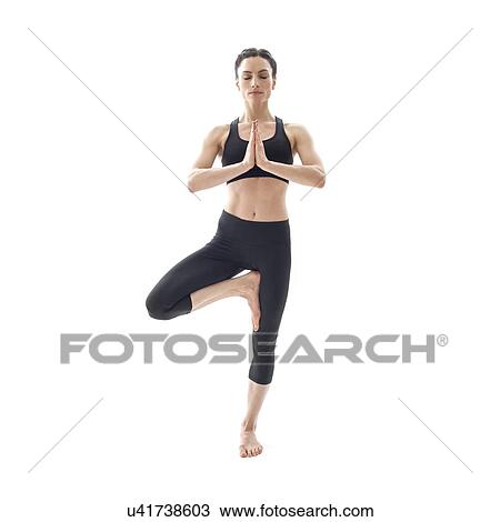 Stock Image - Woman practicing yoga. Fotosearch