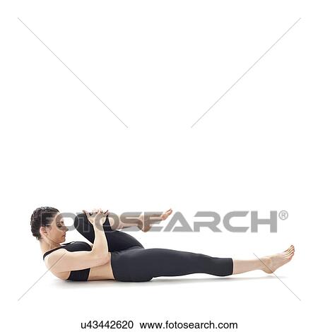 Stock Image - Woman practicing yoga. Fotosearch