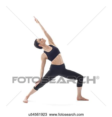 Stock Image - Woman practicing yoga. Fotosearch