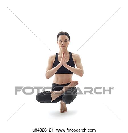 Woman practicing yoga View Large Photo Image Stock Image - Woman practicing yoga. Fotosearch