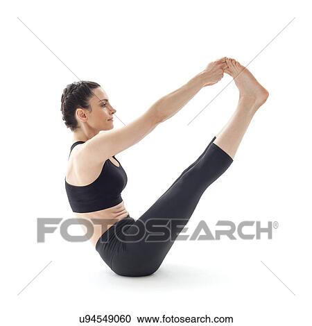 Stock Image - Woman practicing yoga. Fotosearch
