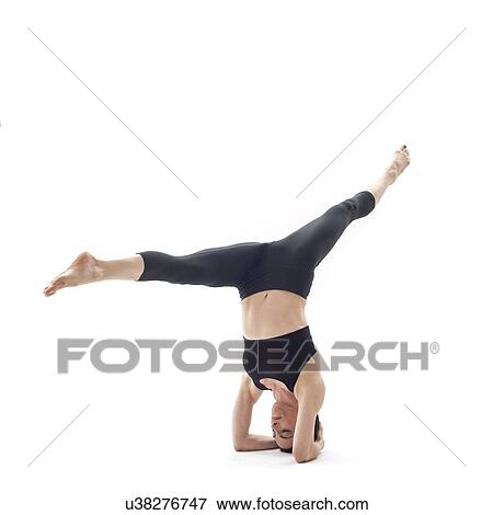 Stock Photo - Woman practicing yoga. Fotosearch