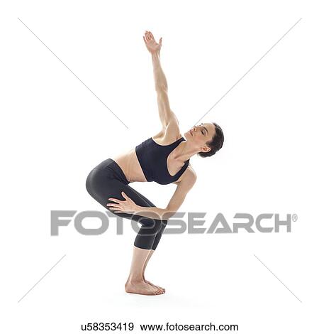 Woman practicing yoga View Large Photo Image Stock Photo - Woman practicing yoga. Fotosearch