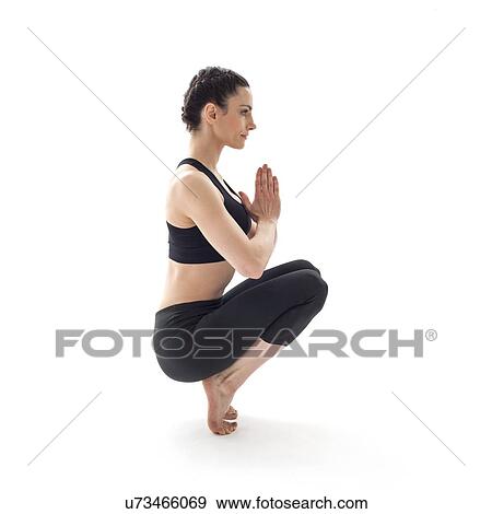 Stock Photo - Woman practicing yoga. Fotosearch