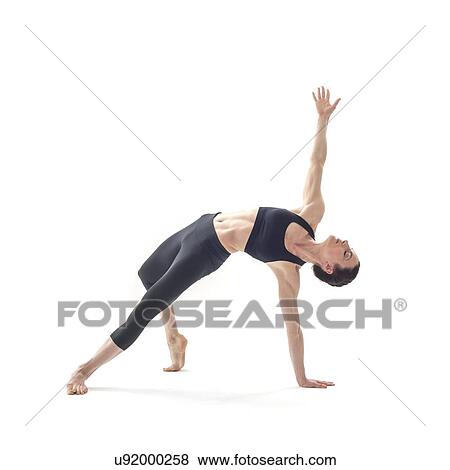 Stock Photo - Woman practicing yoga. Fotosearch