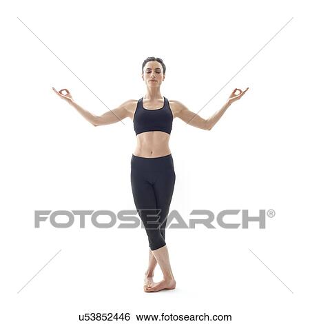 Stock Photograph - Woman practicing yoga. Fotosearch