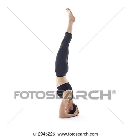 Stock Photography - Woman practicing yoga. Fotosearch