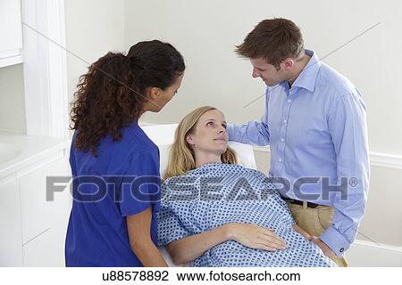 Stock Image - Woman preparing for medical procedure. Fotosearch