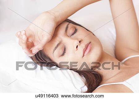 Woman with a headache View Large Photo Image Stock Image - Woman with a headache. Fotosearch