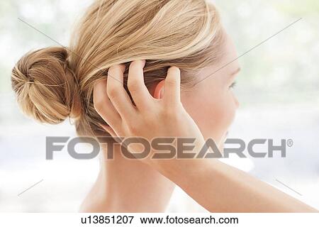 Woman with itchy head View Large Photo Image Stock Photo - Woman with itchy head. Fotosearch