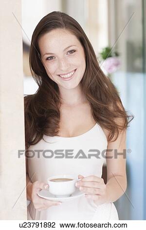 Young woman drinking coffee View Large Photo Image Stock Image - Young woman drinking coffee. Fotosearch