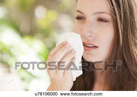 Young woman sneezing View Large Photo Image Stock Image - Young woman sneezing. Fotosearch