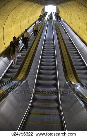 Stock Image - Stairway to heaven in Washington D. C. Metrorail escalator to mass transet trains. Fotosearch