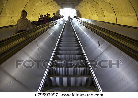 Stock Photo - Stairway to heaven in Washington D. C. Metrorail escalator to mass transet trains. Fotosearch