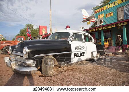 Stock Image - Vintage Black and White police car in Seligman, Arizona off Route 66. Fotosearch