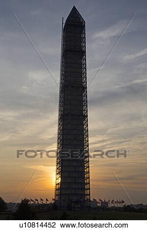 Stock Image - Washington Memorial with Scaffolding at sunset, Washington D. C.. Fotosearch