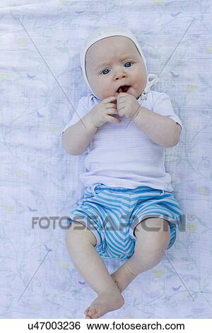 Baby girl lying on back View Large Photo Image Stock Photograph - Baby girl lying on back. Fotosearch