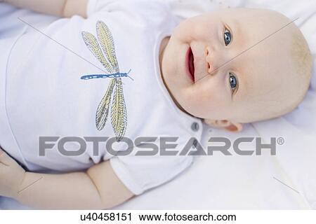 Baby girl smiling at camera View Large Photo Image Stock Image - Baby girl smiling at camera. Fotosearch