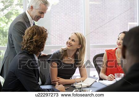 Business colleagues enjoying meeting View Large Photo Image Stock Image - Business colleagues enjoying meeting. Fotosearch