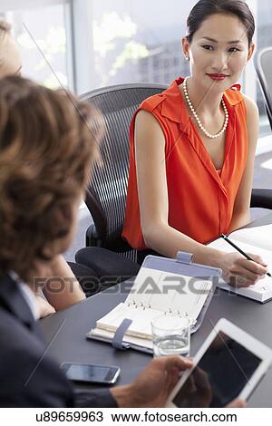 Business colleagues meeting in office View Large Photo Image Stock Image - Business colleagues meeting in office. Fotosearch