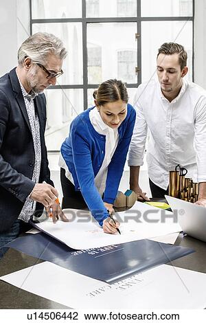 Business people in discussion at office View Large Photo Image Stock Image - Business people in discussion at office. Fotosearch