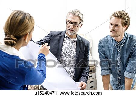 Stock Image - Business people in meeting at office. Fotosearch
