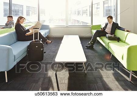 Businesspeople in departure lounge View Large Photo Image Stock Image - Businesspeople in departure lounge. Fotosearch