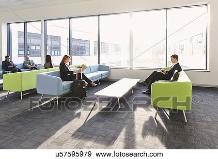 Businesspeople in departure lounge View Large Photo Image Stock Photo - Businesspeople in departure lounge. Fotosearch