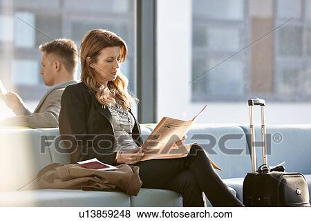 Businesswoman in departure lounge View Large Photo Image Stock Photo - Businesswoman in departure lounge. Fotosearch
