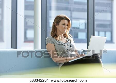 Businesswoman using laptop View Large Photo Image Picture - Businesswoman using laptop. Fotosearch