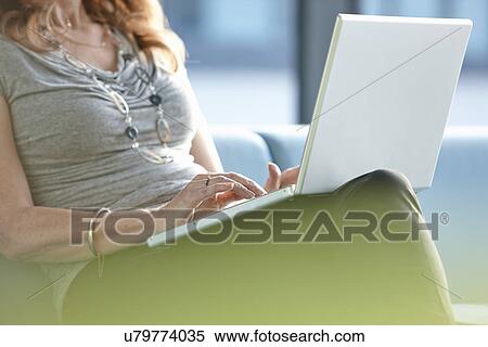 Businesswoman using laptop View Large Photo Image Stock Photography - Businesswoman using laptop. Fotosearch