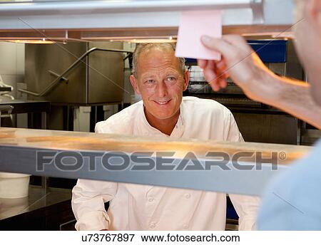 Chef in kitchen View Large Photo Image Stock Photo - Chef in kitchen. Fotosearch