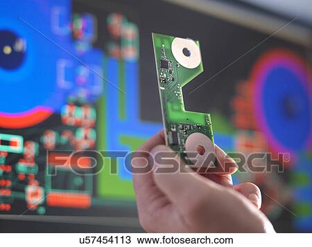 Close up of engineer holding electronic circuitry for automotive use View Large Photo Image Stock Image - Close up of engineer holding electronic circuitry for automotive use. Fotosearch
