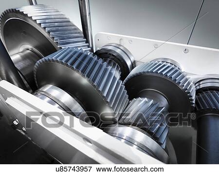 Close up of gears in industrial gearbox View Large Photo Image Stock Photo - Close up of gears in industrial gearbox. Fotosearch