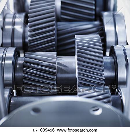 Close up of gears in industrial gearbox View Large Photo Image Stock Photograph - Close up of gears in industrial gearbox. Fotosearch