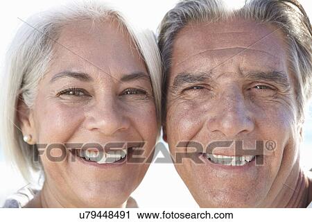 Stock Image - Close up portrait of happy couple. Fotosearch