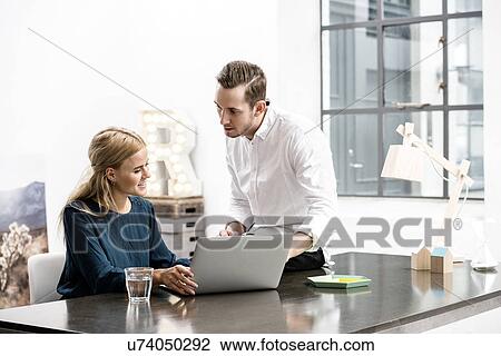 Colleagues in discussion at office View Large Photo Image Stock Image - Colleagues in discussion at office. Fotosearch