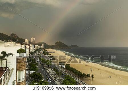 Copacabana beach and rainbow, Rio De Janeiro, Brazil View Large Photo Image Stock Photograph - Copacabana beach and rainbow, Rio De Janeiro, Brazil. Fotosearch