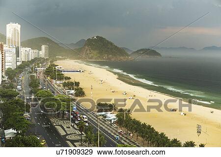 Copacabana beach and storm clouds, Rio De Janeiro, Brazil View Large Photo Image Stock Photo - Copacabana beach and storm clouds, Rio De Janeiro, Brazil. Fotosearch