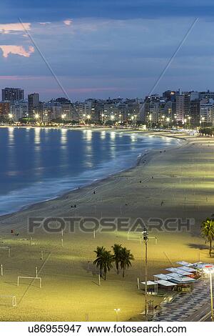 Copacabana beach at nightime, Rio De Janeiro, Brazil View Large Photo Image Stock Photo - Copacabana beach at nightime, Rio De Janeiro, Brazil. Fotosearch
