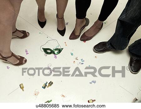 Cropped image of legs and feet at party View Large Photo Image Stock Photography - Cropped image of legs and feet at party. Fotosearch